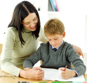 Young Boy Being Tutored by His Teacher --- Image by © Royalty-Free/Corbis